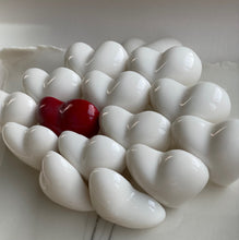 Load image into Gallery viewer, Detail of handmade porcelain hearts with a red heart centre, inspired by home and love