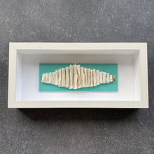 Load image into Gallery viewer, Handmade porcelain wall piece featuring sculpted scrolls on a turquoise tile with a 24 karat gold accent.
